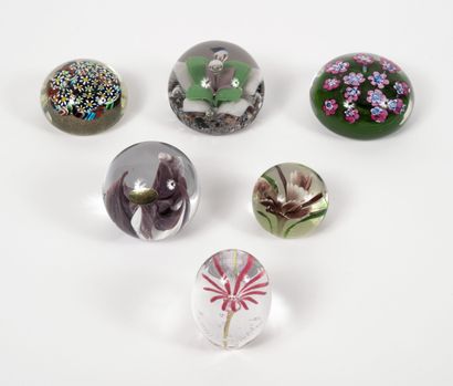 Six paperweights of ovoid forms, or in balls,...
