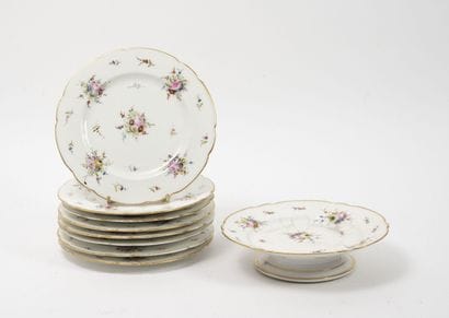 Eight dessert plates and a cake stand in...