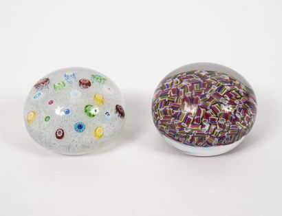 BACCARAT
Two paperweights in colorless crystal...