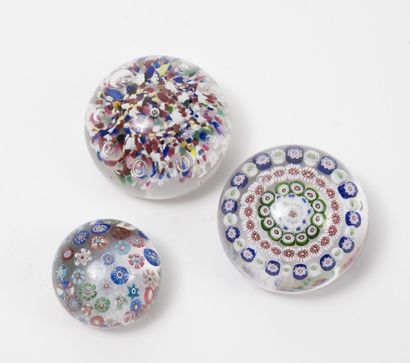 Three paperweights in crystal or colorless...