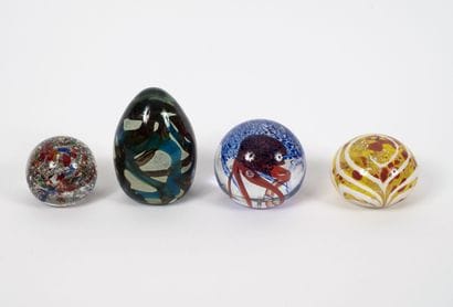 Four paperweights of spherical form, some...