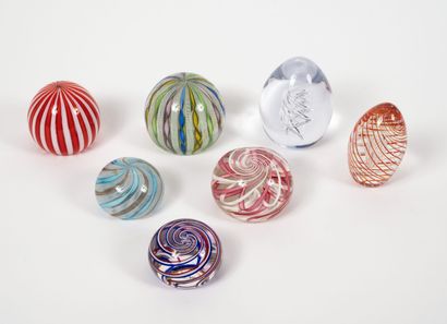 Seven paperweights, of ball or obusal shape,...