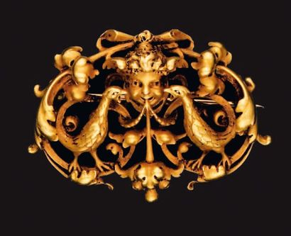 WIESE. Broche en or ajouré à décor de rinceaux...