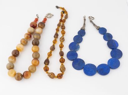 Lot including three necklaces: 
- One formed...