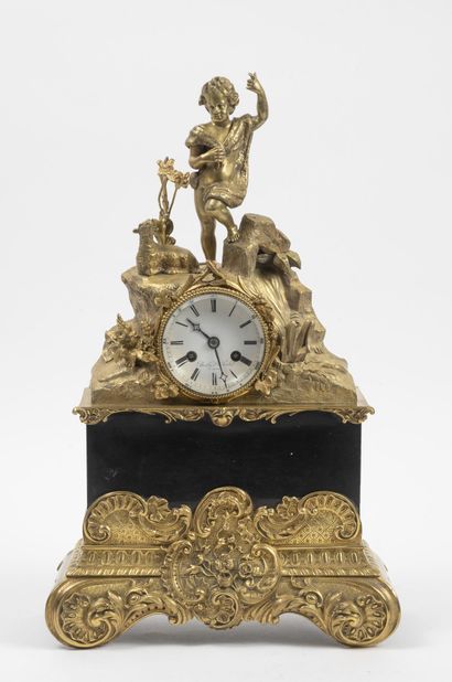 Clock in bronze and gilt brass and black...