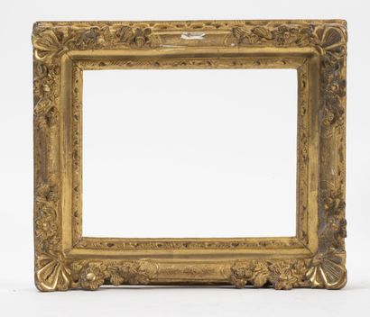 Wooden frame carved with flowers and palmettes...