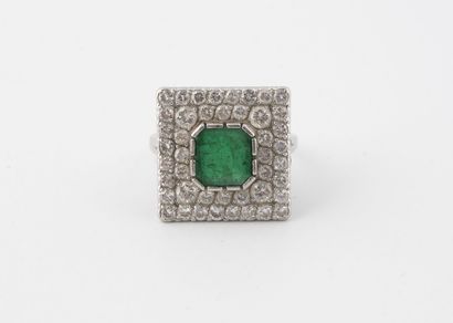 Platinum (850) ring with a square top centered...