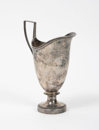 Small water jug on circular pedestal in silver...