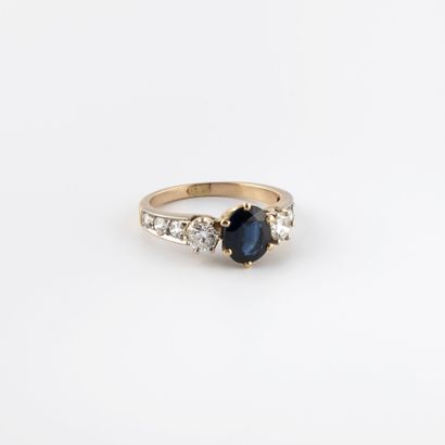 Yellow gold (750) ring centered on an oval...