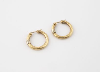Pair of creoles in yellow gold (750) with...