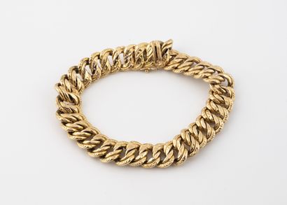 Bracelet gourmette en or jaune (750) à maille...