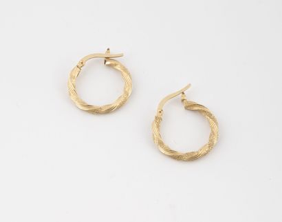 Pair of yellow gold (750) twisted earrings....