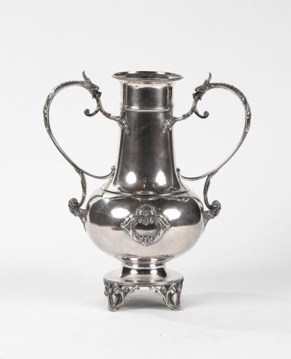 Large silvered metal vase, forming a trunk,...