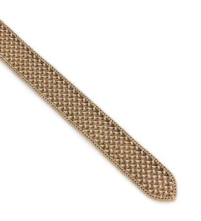 Bracelet belt in yellow gold (750) braided.
Clasp,...