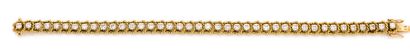 Line bracelet in yellow gold (750) textured...