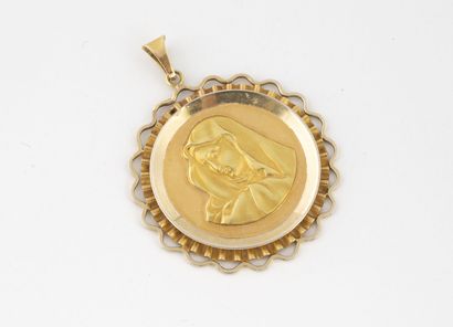 Round pendant centered with a religious medal...