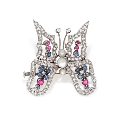 Broche en or gris 750 millièmes, stylisant...