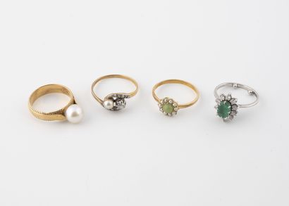 Four yellow or white gold rings (750), set...