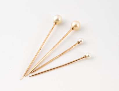 Four yellow gold (750) collar pins topped...