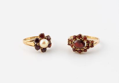 Two yellow gold (375) rings set with round...