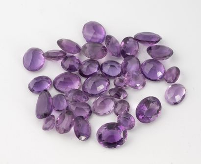 Lot of round or oval faceted amethysts of...