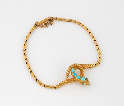 Supple bracelet in yellow gold (750) centered...