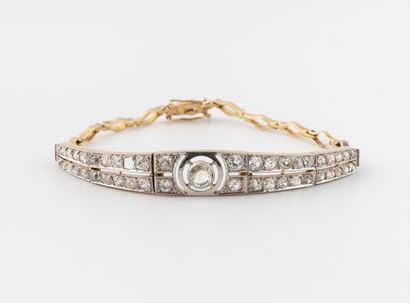 Bracelet in yellow gold (750) and platinum...