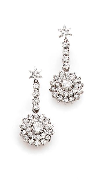 A pair of white gold (750) earrings featuring...