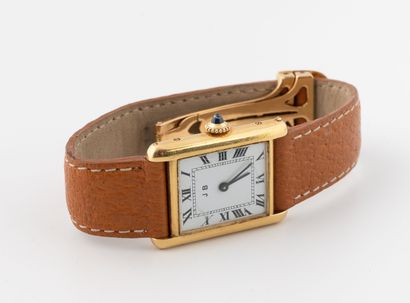 Wristwatch in yellow gold (750).
White enameled...