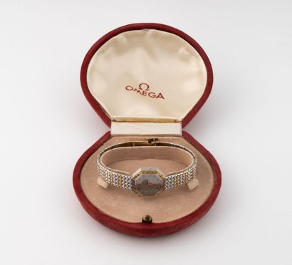 OMEGA
Ladies' wristwatch in steel and gold-plated...