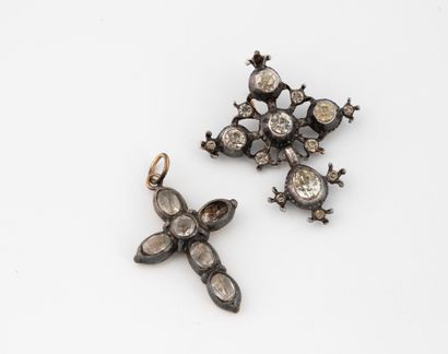 Two crosses set with white stones :
- one...