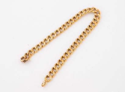Bracelet en or jaune (750) à maille gourmette.
Fermoir...