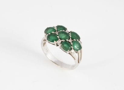 A white gold (750) ring set with seven oval...