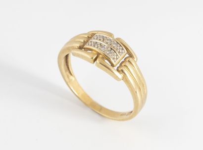 Yellow gold (750) ring with a buckle motif...