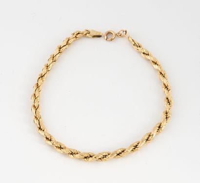 Yellow gold (750) hollow twisted link bracelet....