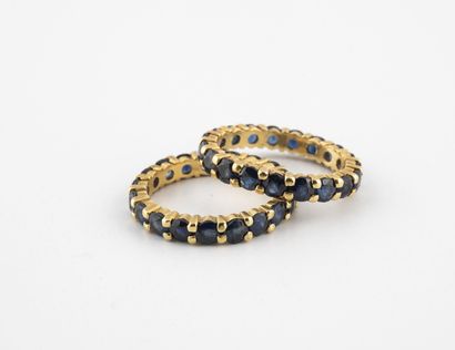 Two American wedding bands in yellow gold...