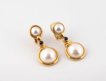 Pair of ear clips in yellow gold (750) holding...
