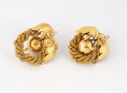 Pair of earrings in yellow gold (750) decorated...