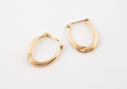 Pair of creole hoop earrings in yellow gold...