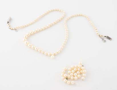 White cultured pearl necklace. 
750 white...