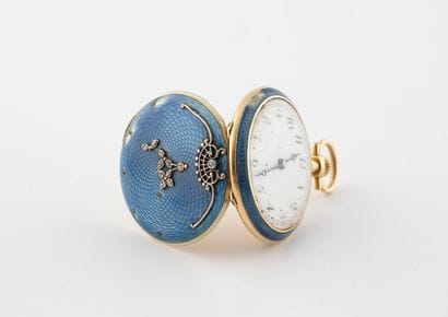 Yellow gold (750) collar watch.
Blue enameled...