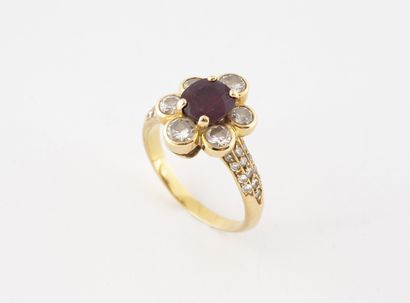Yellow gold (750) flower ring centered on...