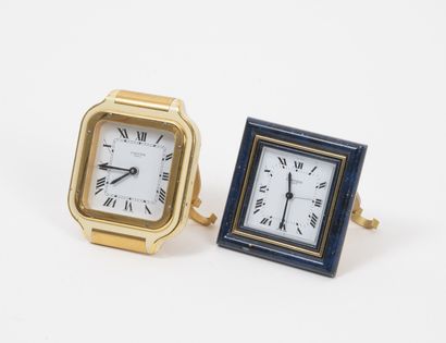 CARTIER
Set of two alarm clocks, one oval...