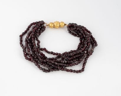 Bracelet with eight rows of faceted garnet...
