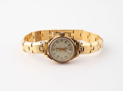 BUTEX
Ladies' wristwatch.
Round case in yellow...