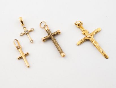Lot of four religious cross pendants in yellow...