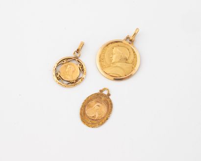 Lot of three round or oval religious medals...