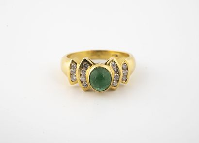 Yellow gold (750) ring centered on an oval-cut...