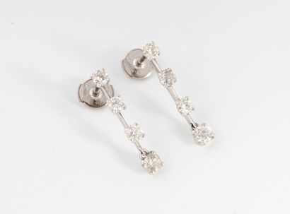 Pair of white gold (750) earrings set with...