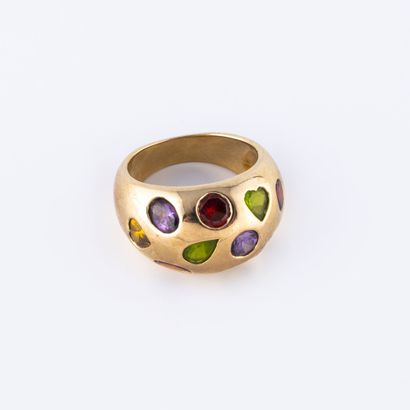 Gilded metal band ring set with faceted oval,...